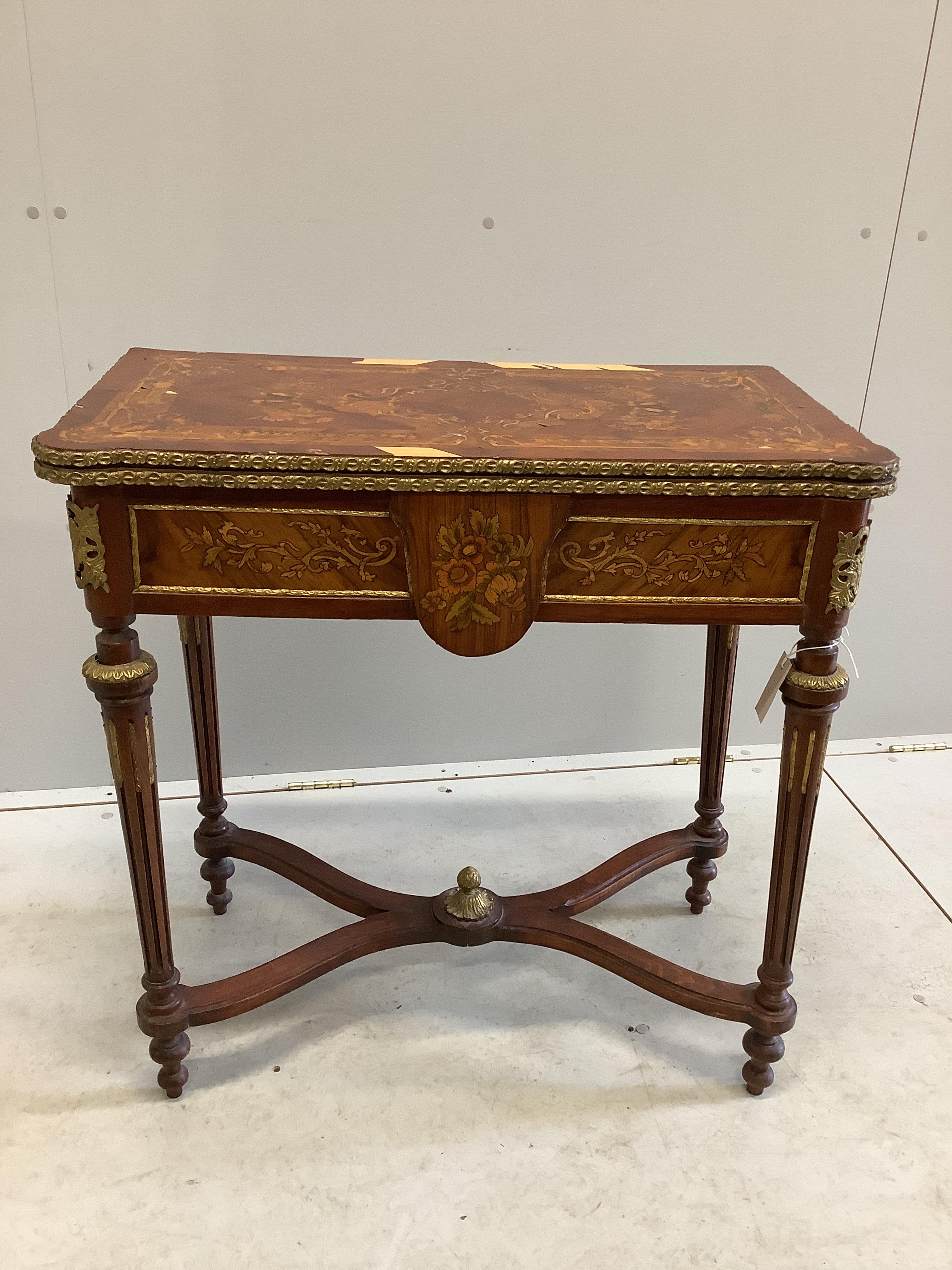 A Louis XVI style gilt metal mounted and marquetry inlaid folding card table, width 77cm, depth 40cm, height 78cm